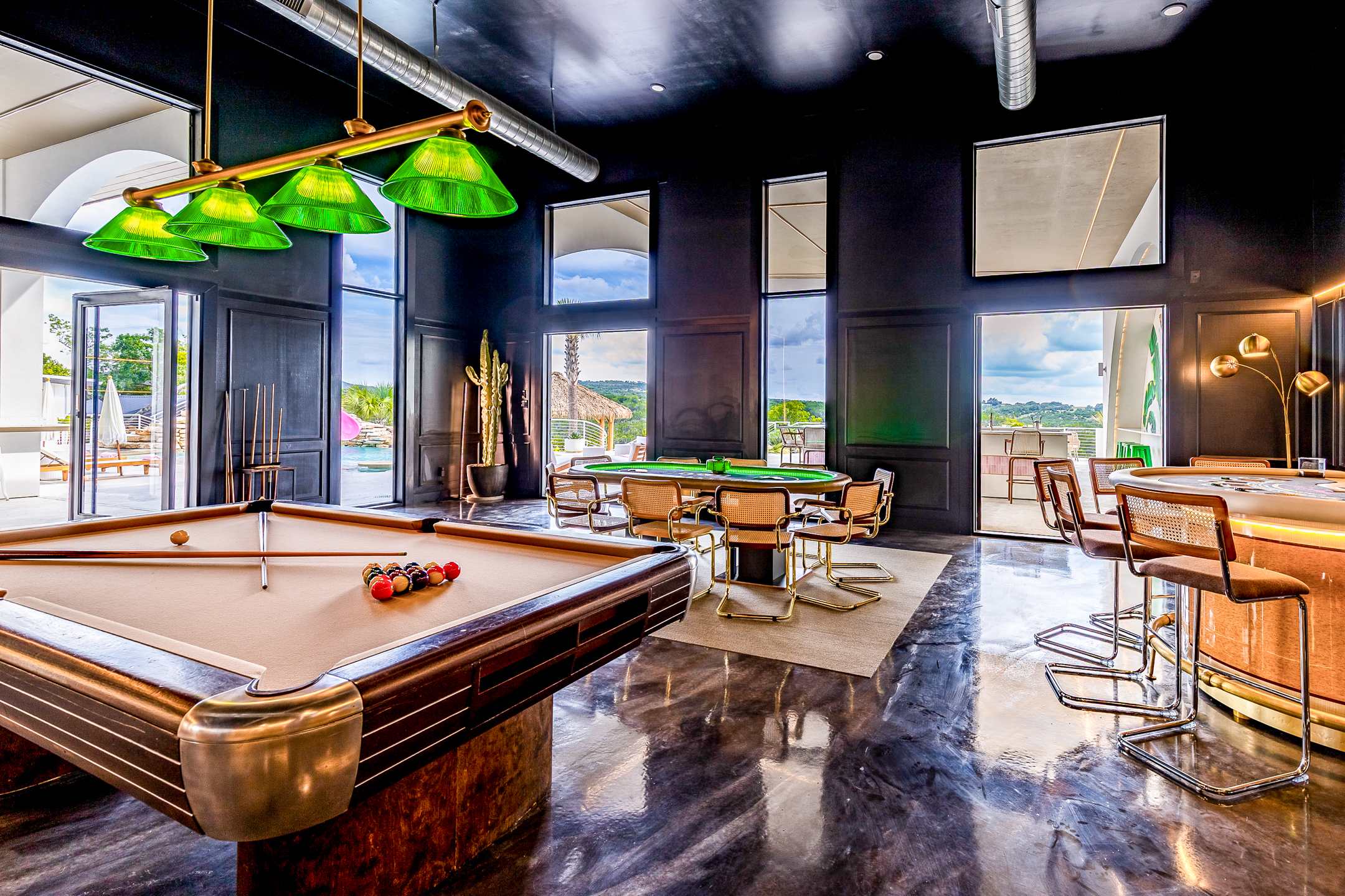 Grand Villa game room with pool, poker, and casino tables